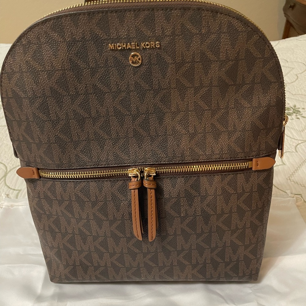 Michael Kors, pre loved some wear with a few stains but in good condition.